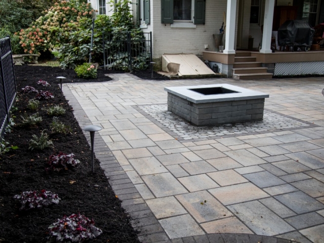 Check out this project we recently finished. As one of the top stone patio installation companies in camp hill PA, we are always seeking ways to thrill our clients. This image shows a fire pit in the center of the patio.
